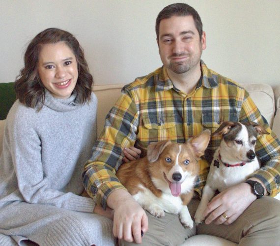 Sean and Jordan with their dogs on the couch